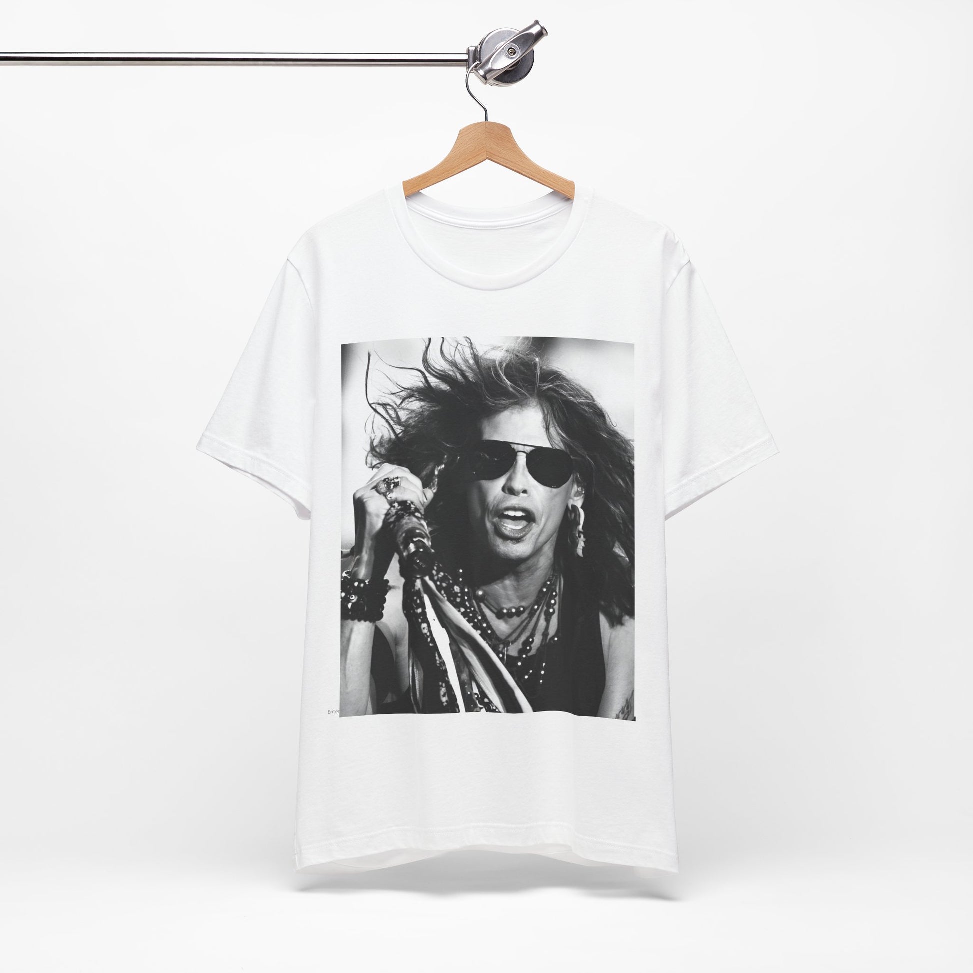 A black graphic t-shirt featuring a black and white photo of Aerosmith's Steven Tyler with his signature scarf and microphone, captured during a dynamic performance.