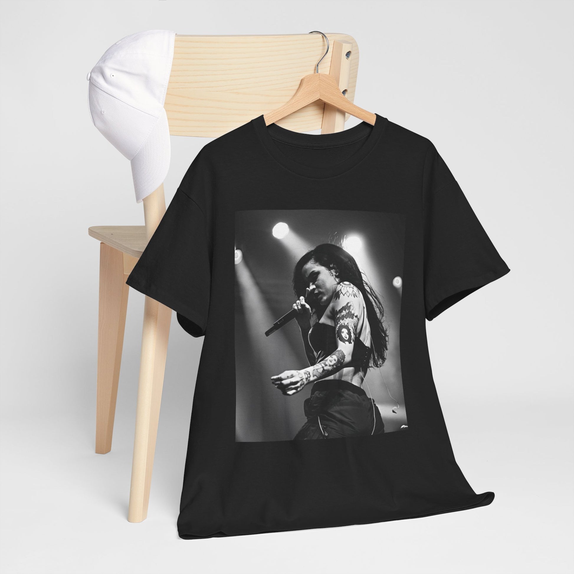 A black graphic t-shirt featuring a glamorous graphic or photo of Kehlani performing on stage.