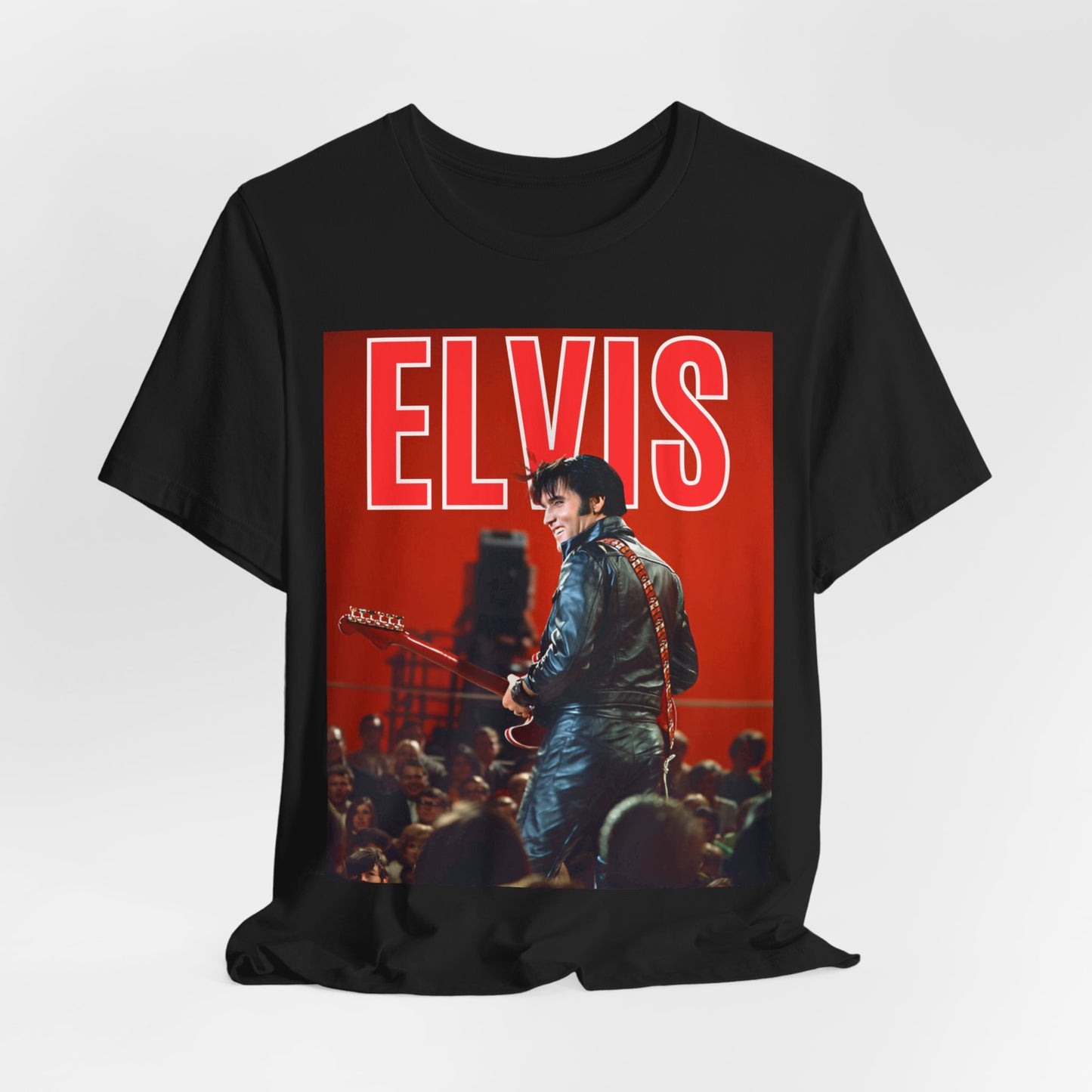 A black graphic t-shirt featuring a vintage graphic of Elvis Presley as the King of Rock 'n' Roll.