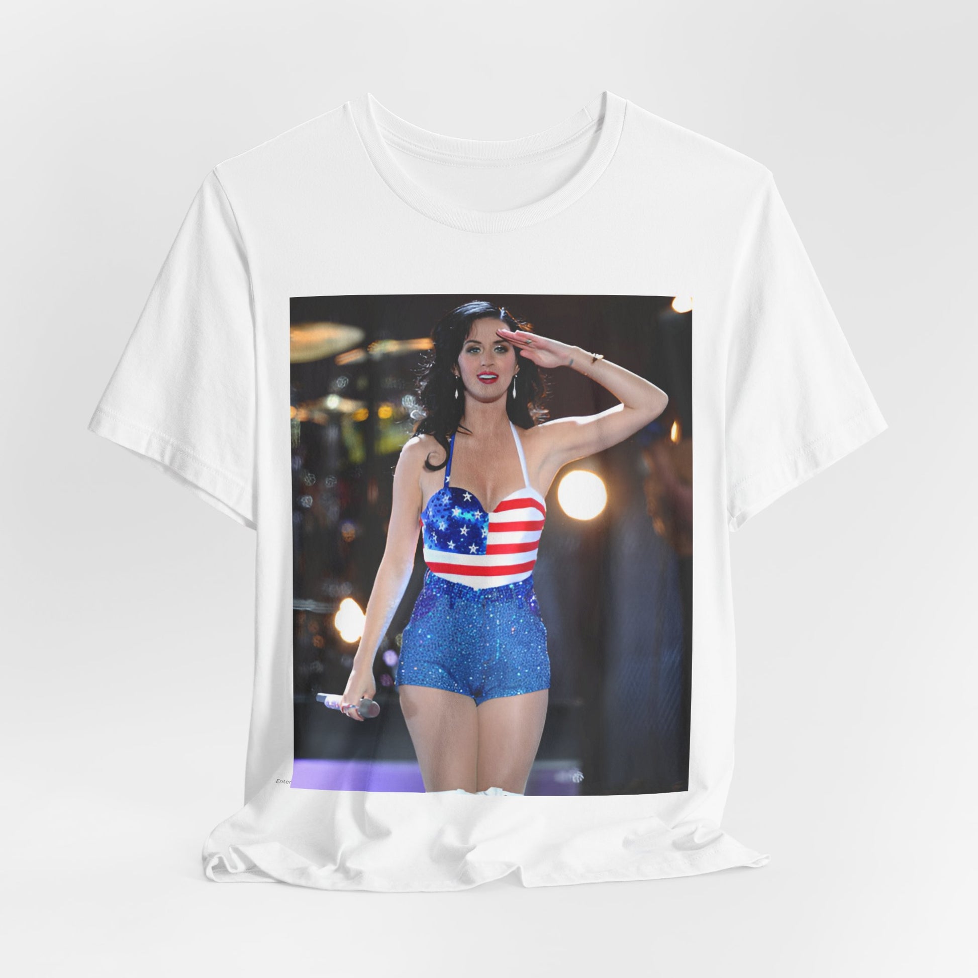 A black graphic t-shirt featuring a vintage graphic related to Katy Perry's 'Firework' song or era.