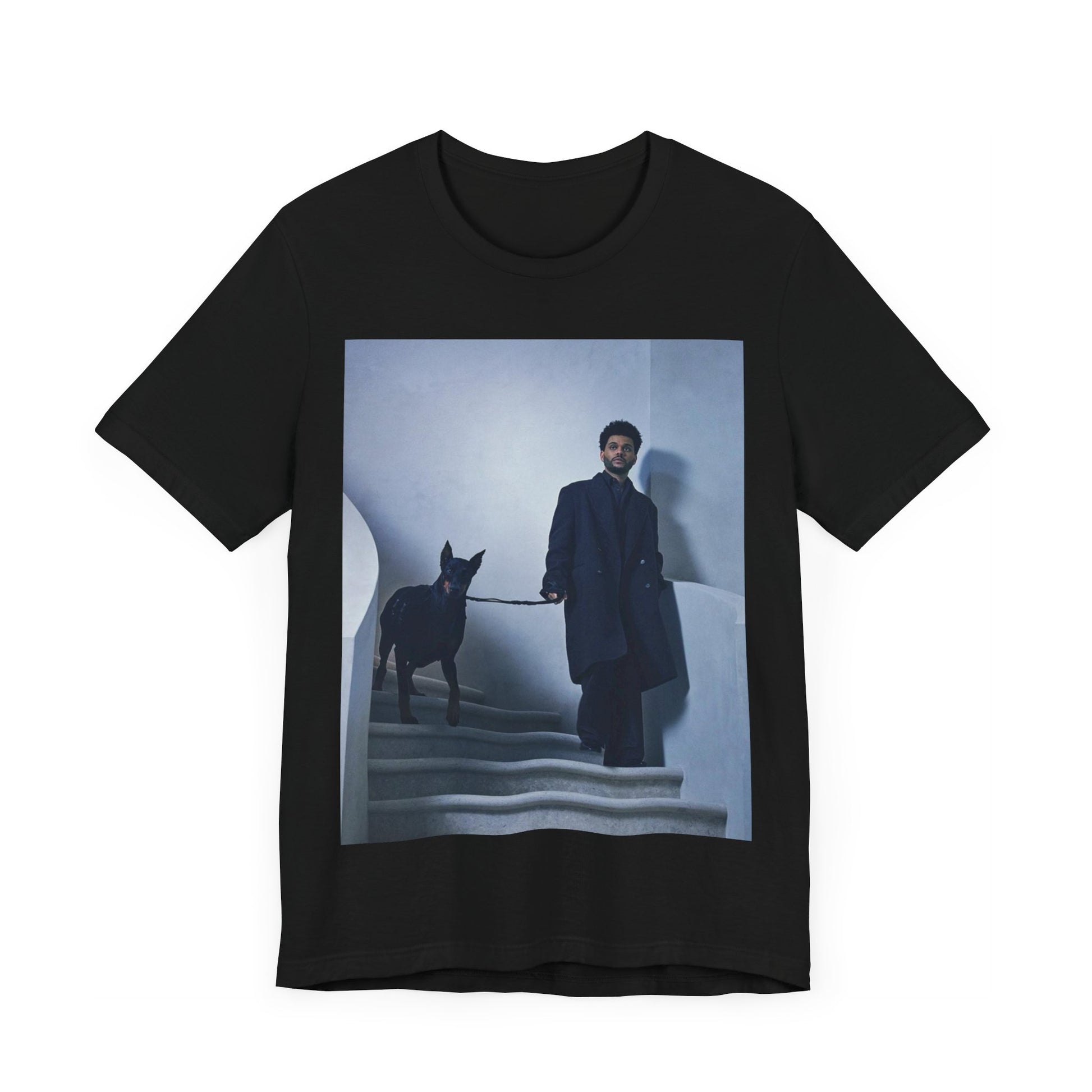 A black graphic t-shirt featuring a photo of The Weeknd with a doberman.