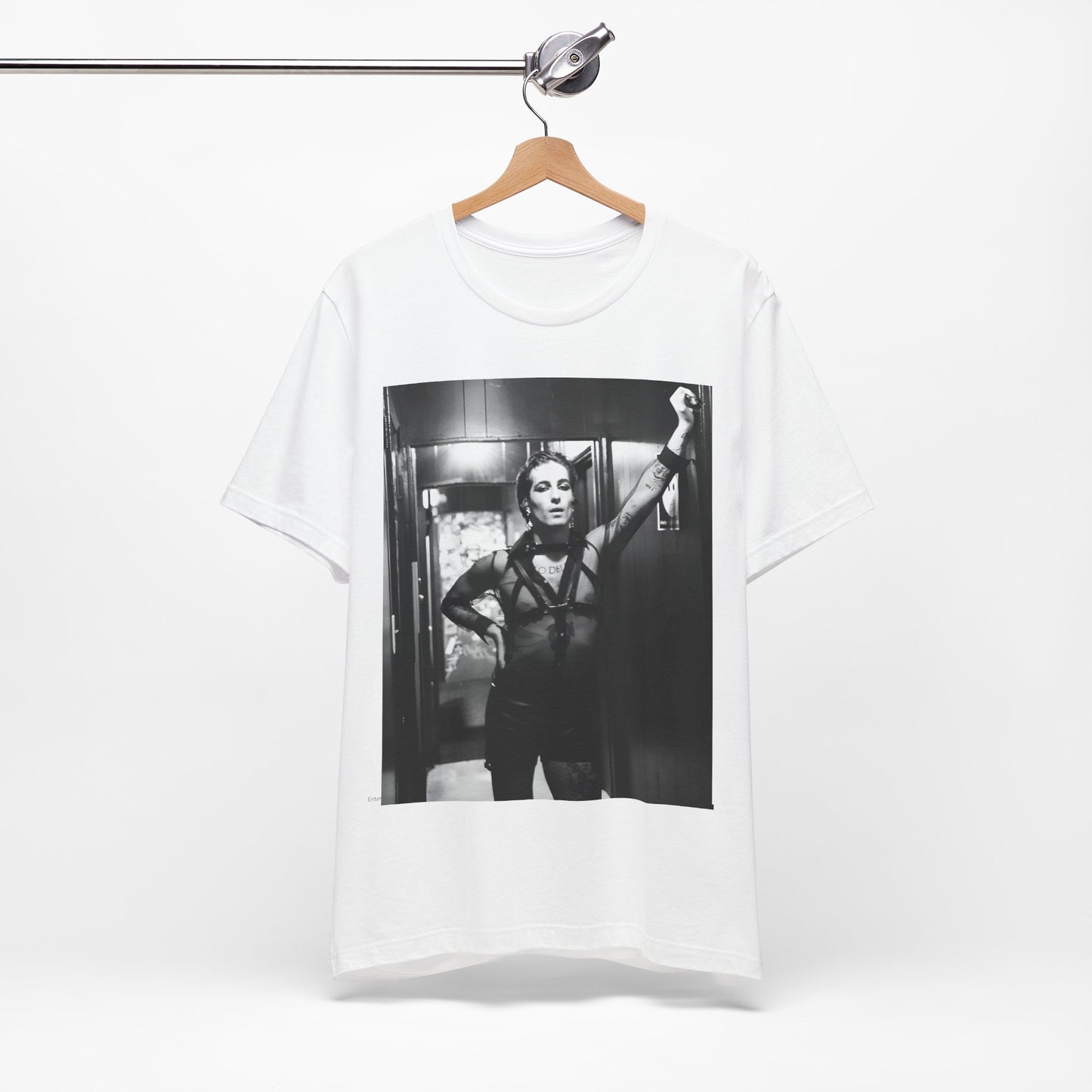 A black graphic t-shirt featuring a graphic of Maneskin emphasizing a rebel rock spirit.