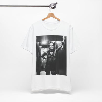 A black graphic t-shirt featuring a graphic of Maneskin emphasizing a rebel rock spirit.