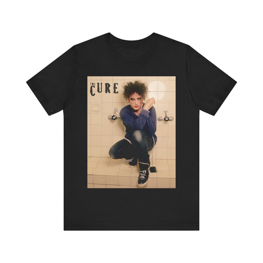 A black graphic t-shirt featuring a graphic related to The Cure's 'Friday I'm In Love' song or era.