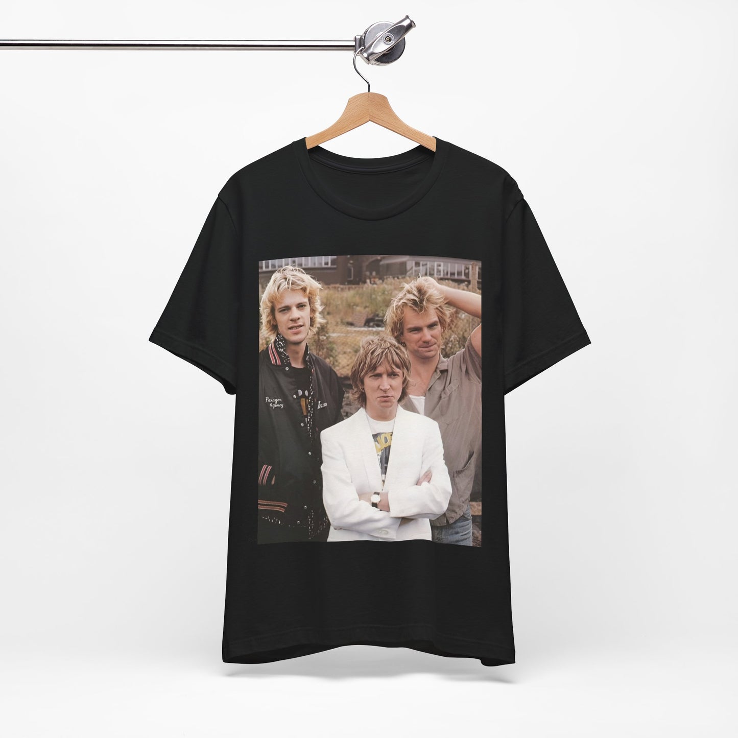 A black graphic t-shirt featuring a graphic of The Police as a timeless three-piece band.