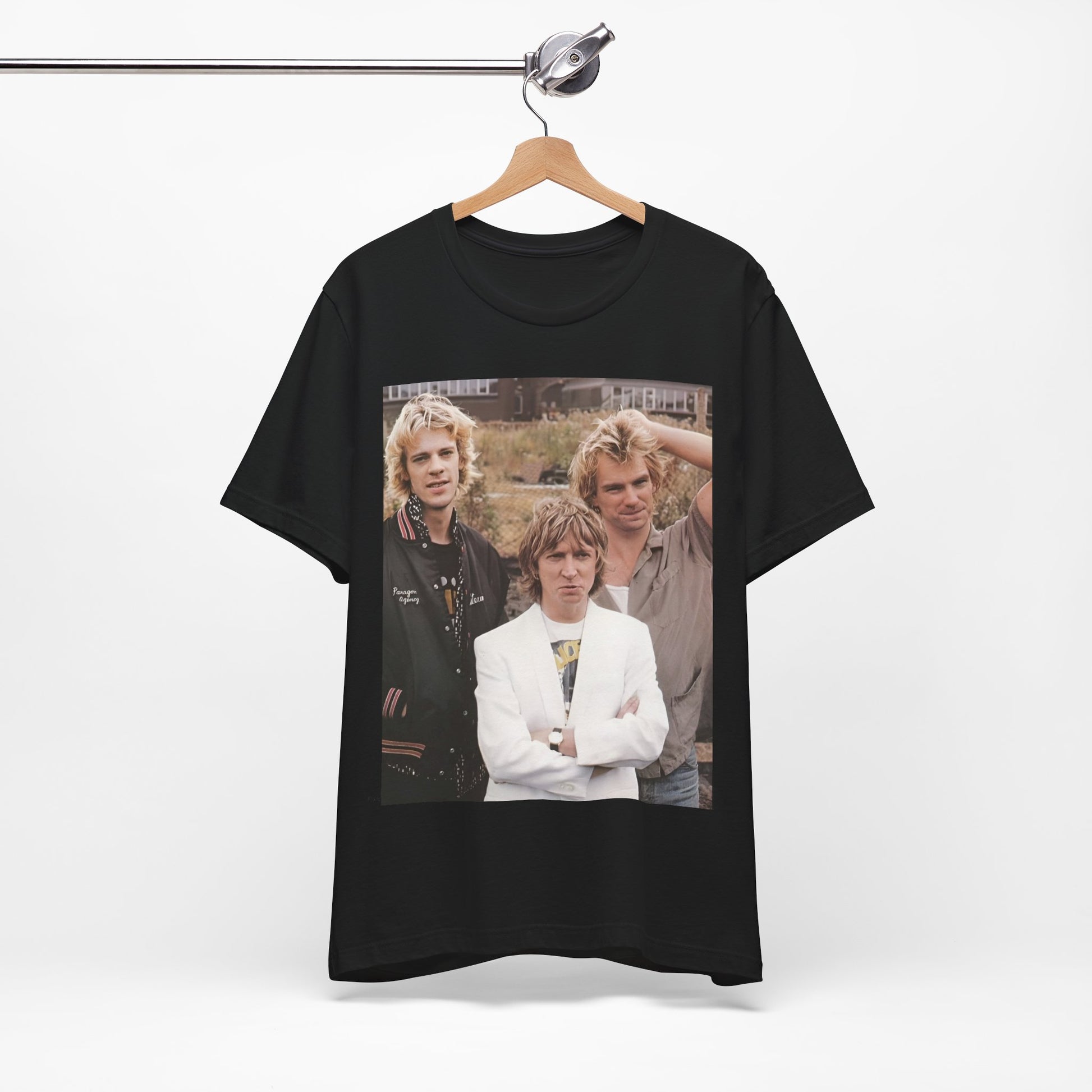 A black graphic t-shirt featuring a graphic of The Police as a timeless three-piece band.