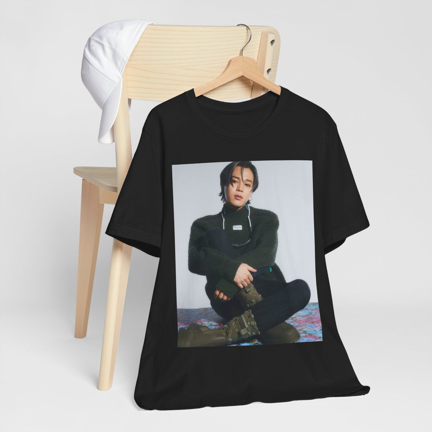 A black graphic t-shirt featuring a modern K-Pop essential graphic of Jimin.