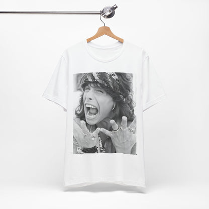 A black graphic t-shirt featuring a candid, dynamic photo of Aerosmith band members on tour in the 1970s, possibly showing action or interaction on stage or backstage.