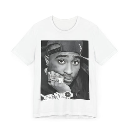 A black graphic t-shirt featuring a bold graphic of Tupac as a rap superstar.
