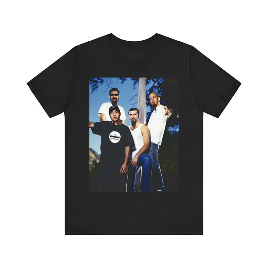 A black graphic t-shirt featuring a vintage alt metal graphic of System of a Down.