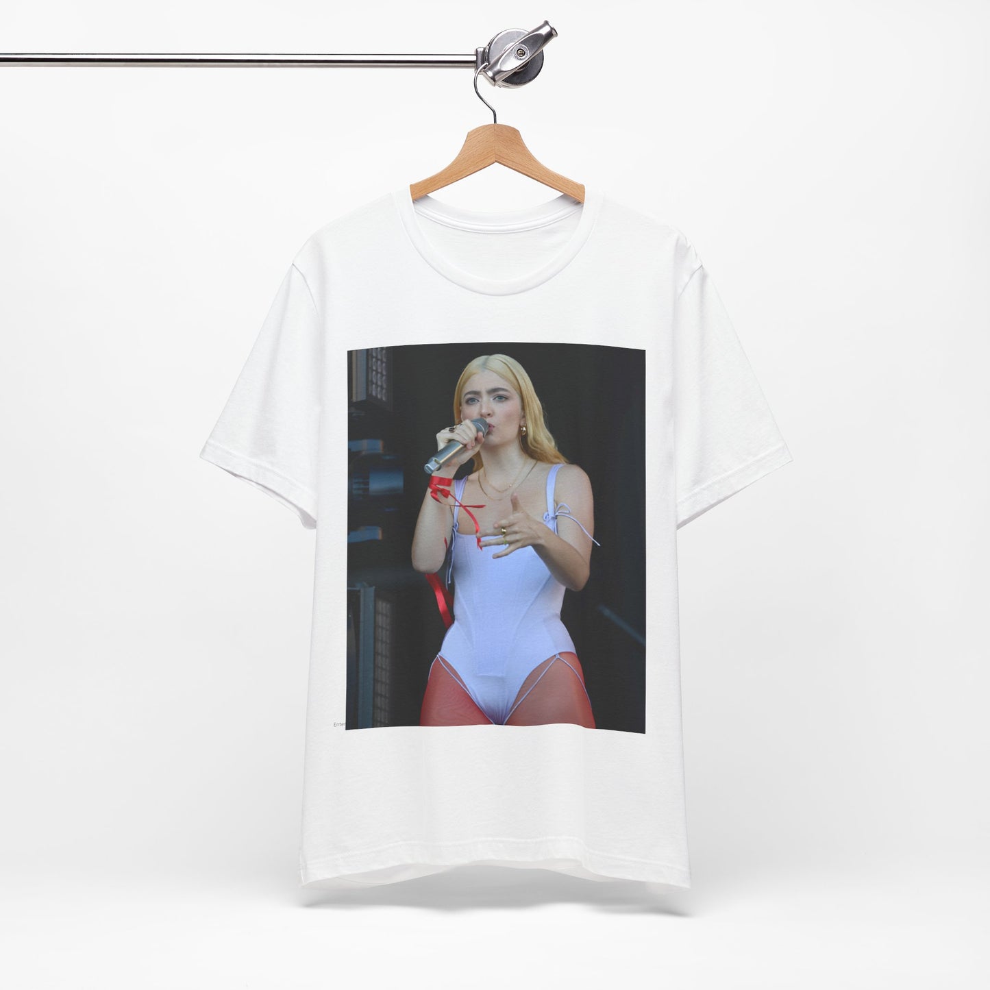A black graphic t-shirt featuring a graphic or photo of Lorde performing on stage in a cool alternative music style.