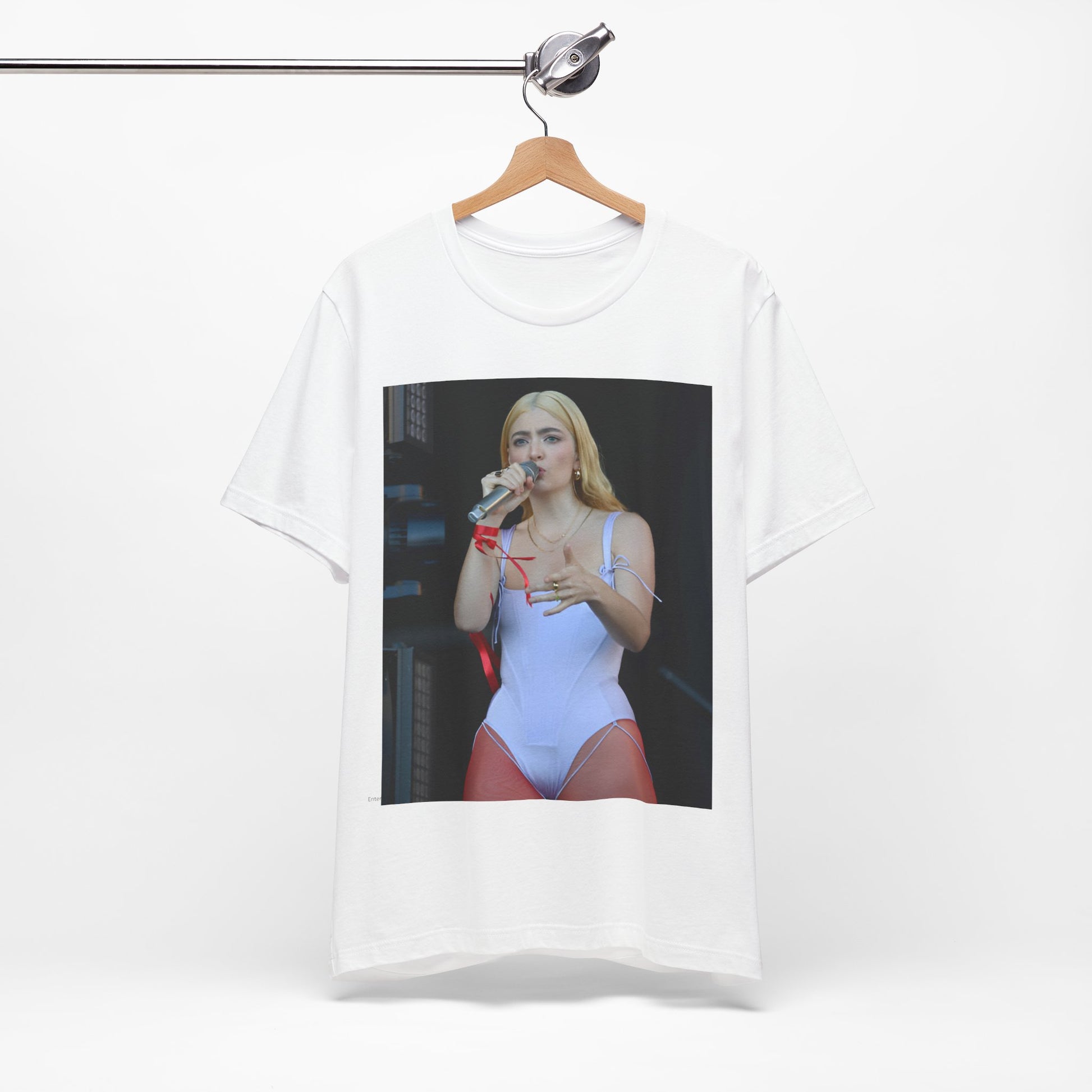 A black graphic t-shirt featuring a graphic or photo of Lorde performing on stage in a cool alternative music style.