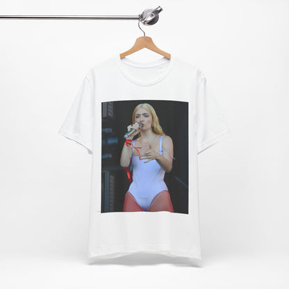 A black graphic t-shirt featuring a graphic or photo of Lorde performing on stage in a cool alternative music style.