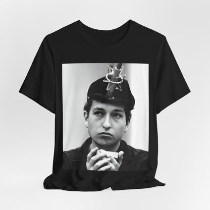 A black graphic t-shirt featuring a graphic of Bob Dylan in an acoustic session setting, possibly with his guitar.