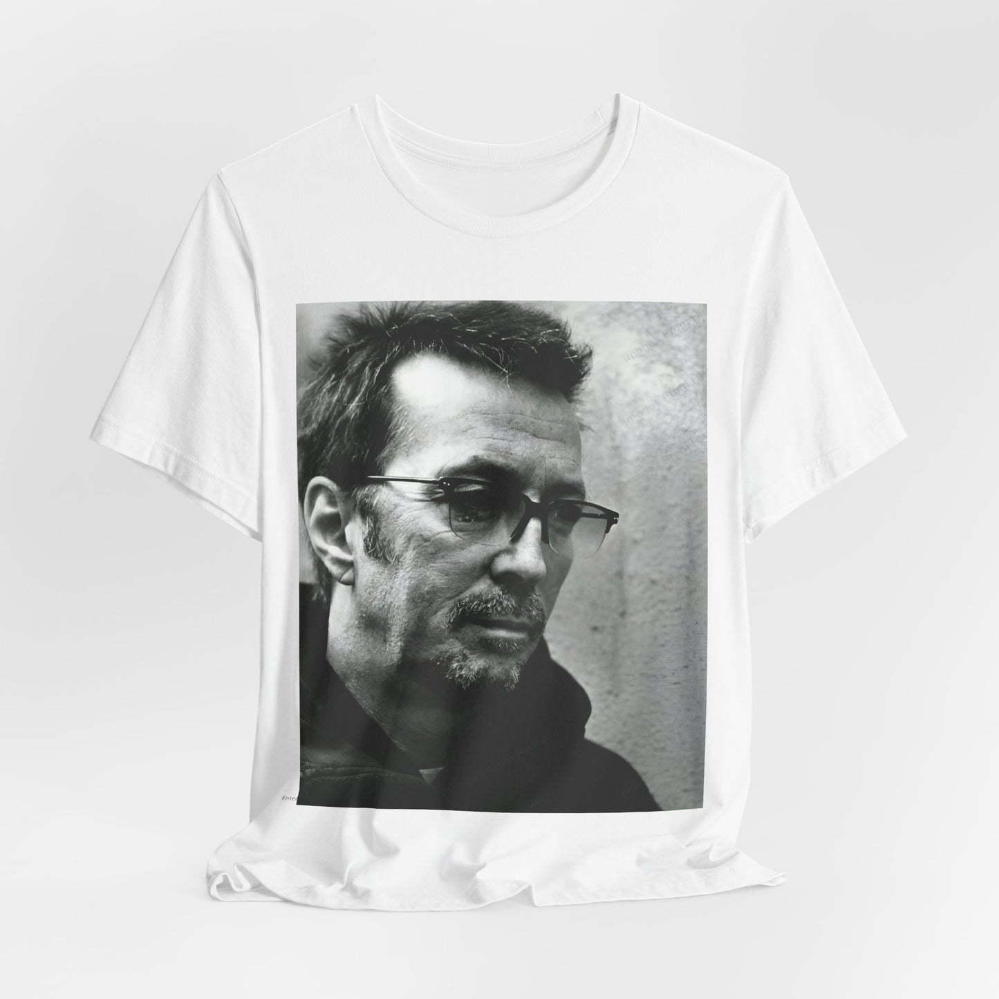 A black graphic t-shirt featuring a black and white, monochrome graphic or photo of Eric Clapton.