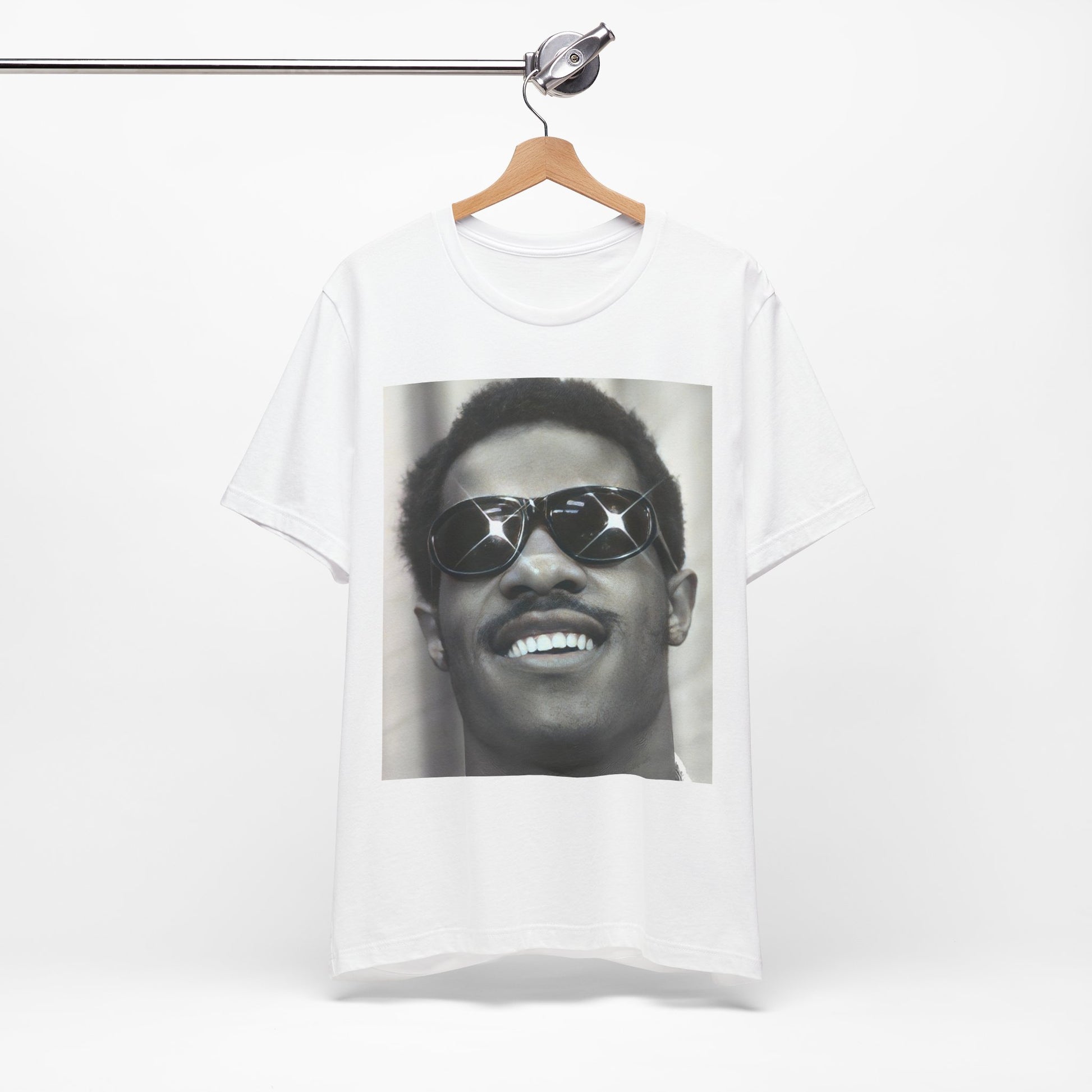 A black graphic t-shirt featuring a 70s funk aesthetic black and white graphic or photo of Stevie Wonder.