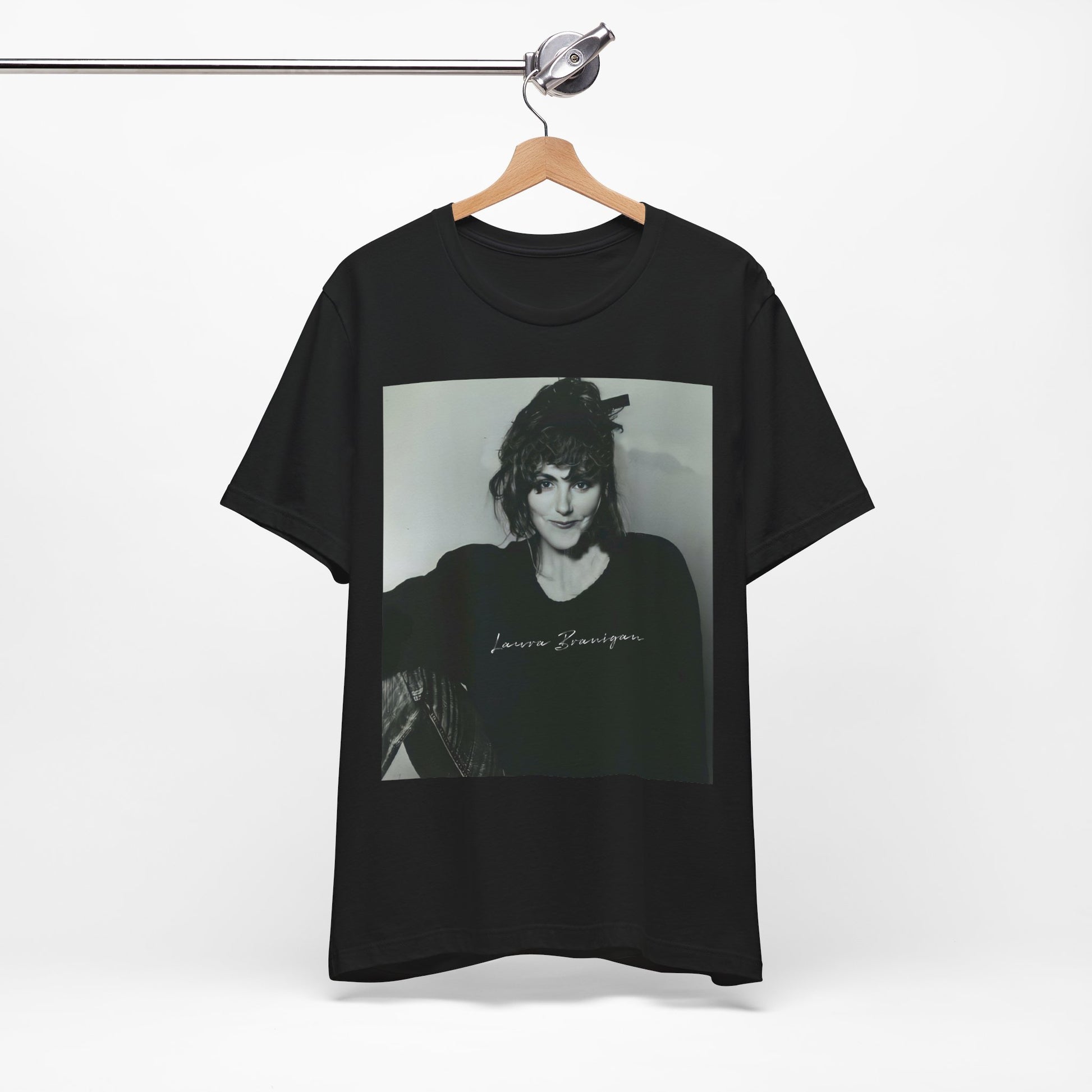 A black graphic t-shirt featuring a casual 80s pop fan graphic of Laura Branigan.