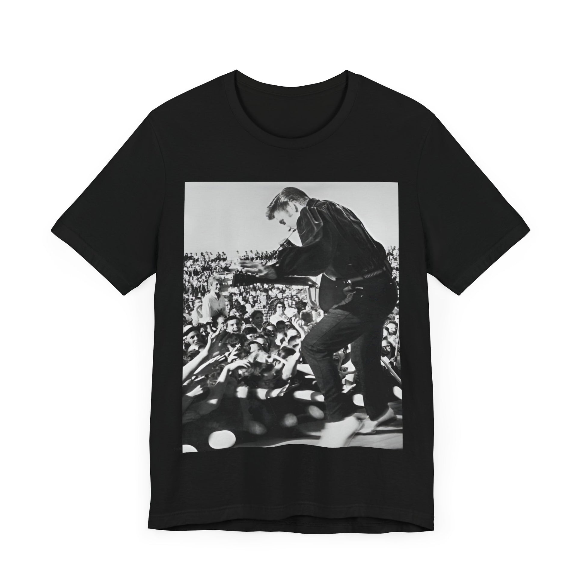 A black graphic t-shirt featuring a retro photo of Elvis Presley performing live in concert in the 1950s.