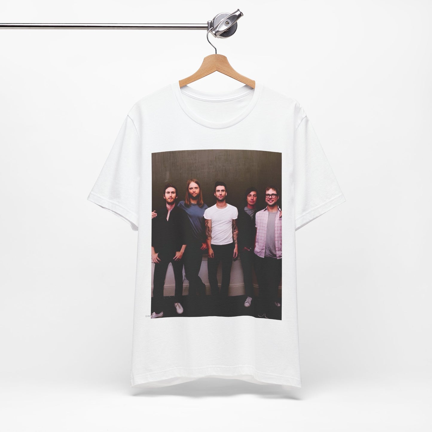 A black cotton Maroon 5 t-shirt featuring a graphic of an artistic, emotional heart design.