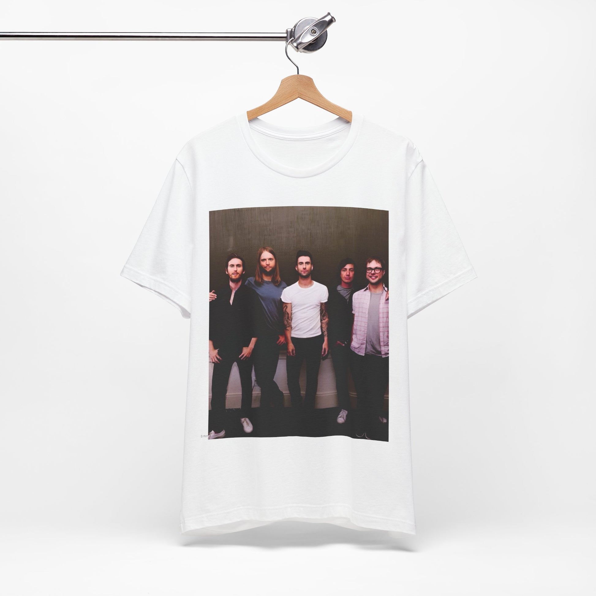 A black cotton Maroon 5 t-shirt featuring a graphic of an artistic, emotional heart design.
