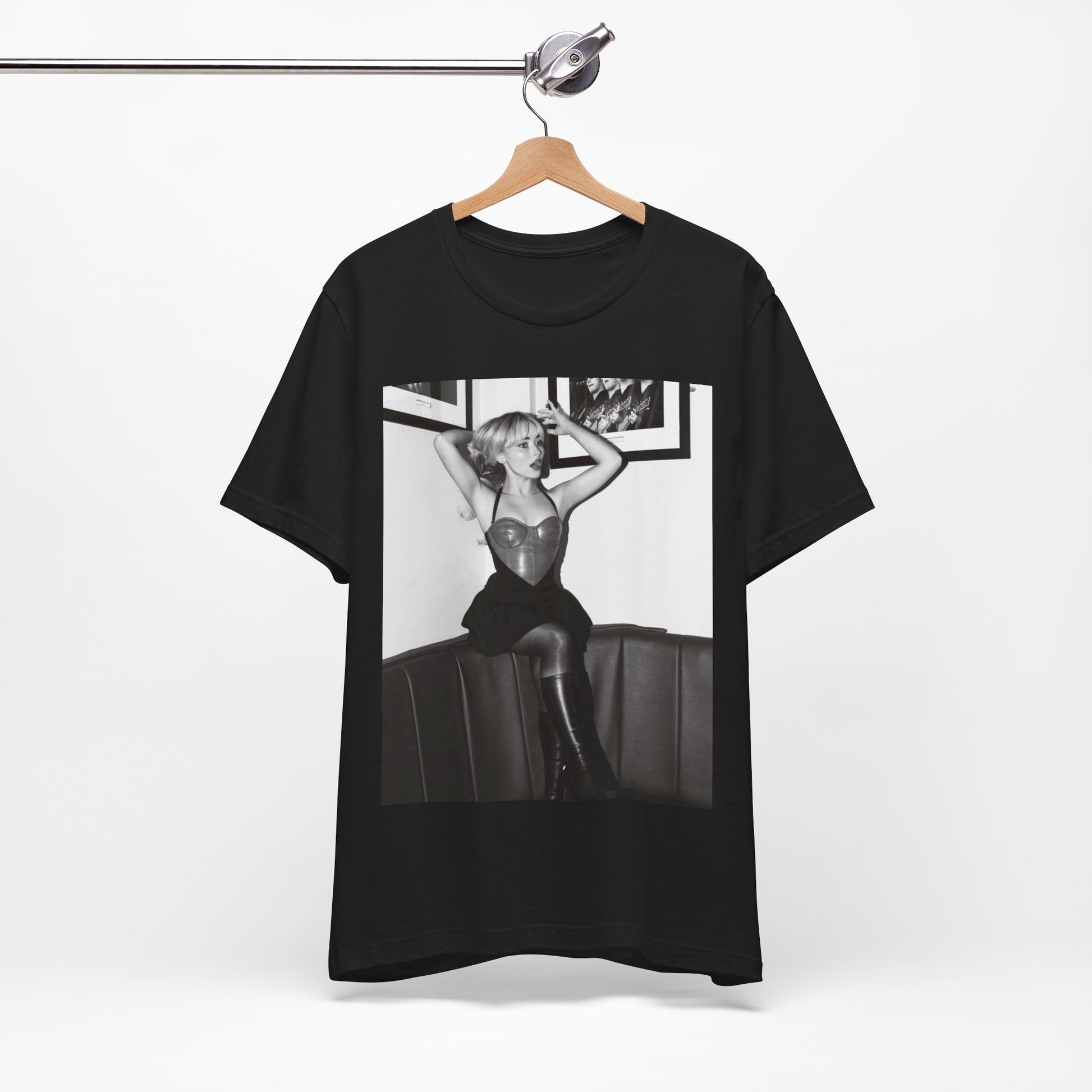 A black graphic t-shirt featuring a black and white graphic of Sabrina Carpenter as a pop princess.