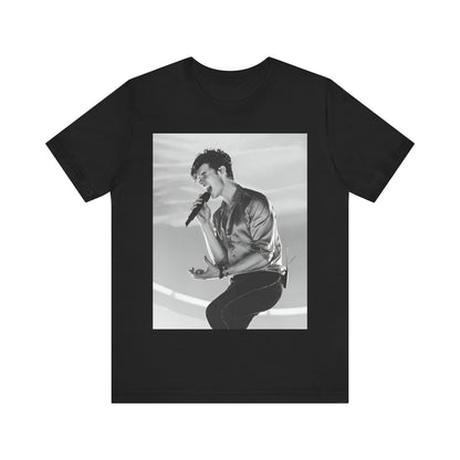 A black graphic t-shirt featuring a black and white graphic or photo of Shawn Mendes as a dreamy pop star.