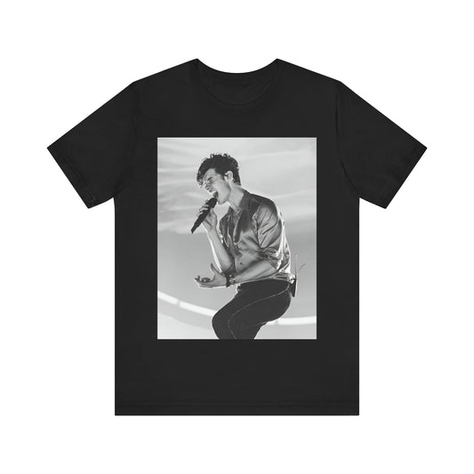 A black graphic t-shirt featuring a black and white graphic or photo of Shawn Mendes as a dreamy pop star.