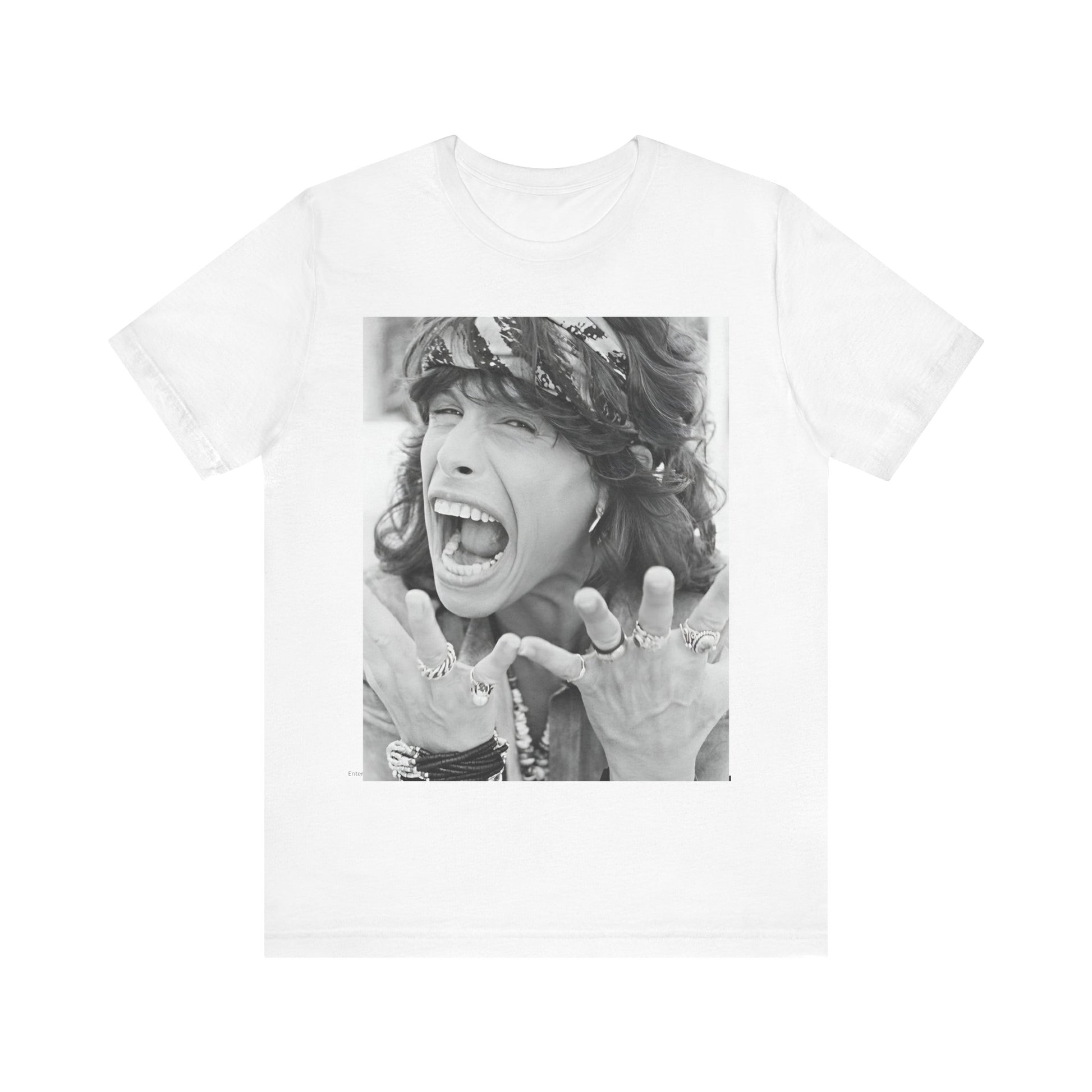 A black graphic t-shirt featuring a candid, dynamic photo of Aerosmith band members on tour in the 1970s, possibly showing action or interaction on stage or backstage.