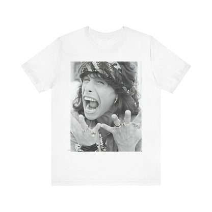 A black graphic t-shirt featuring a candid, dynamic photo of Aerosmith band members on tour in the 1970s, possibly showing action or interaction on stage or backstage.