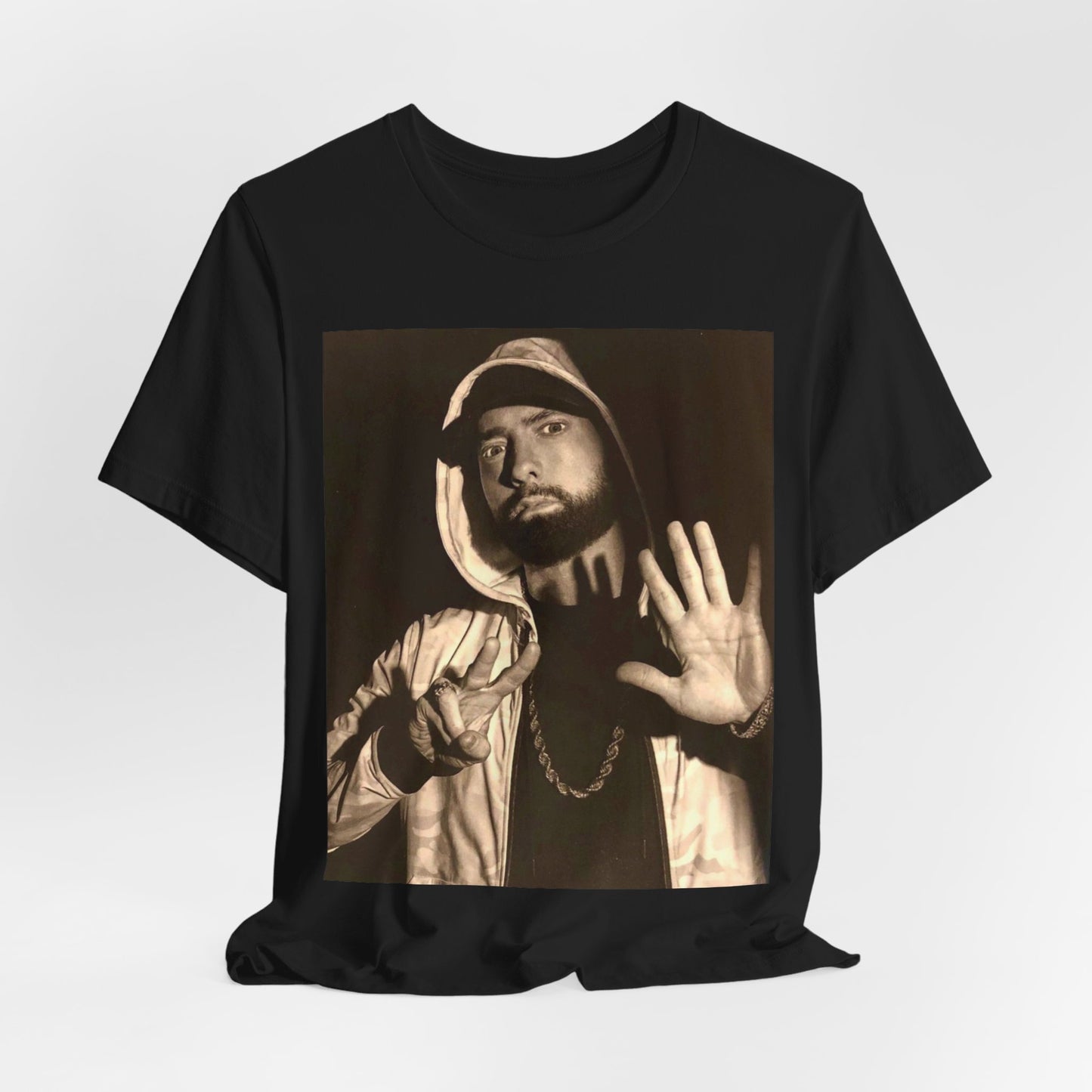 A black graphic t-shirt featuring a graphic of Eminem as an authentic underground rap icon.