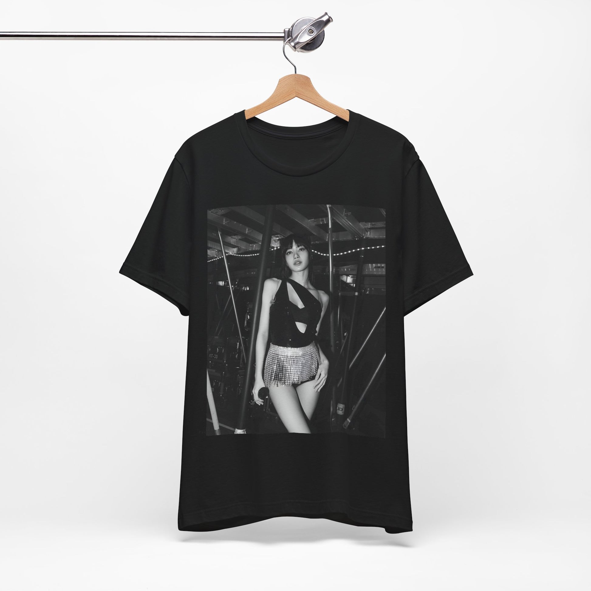 A black graphic t-shirt featuring a black and white graphic or photo of Lisa in a backstage setting.