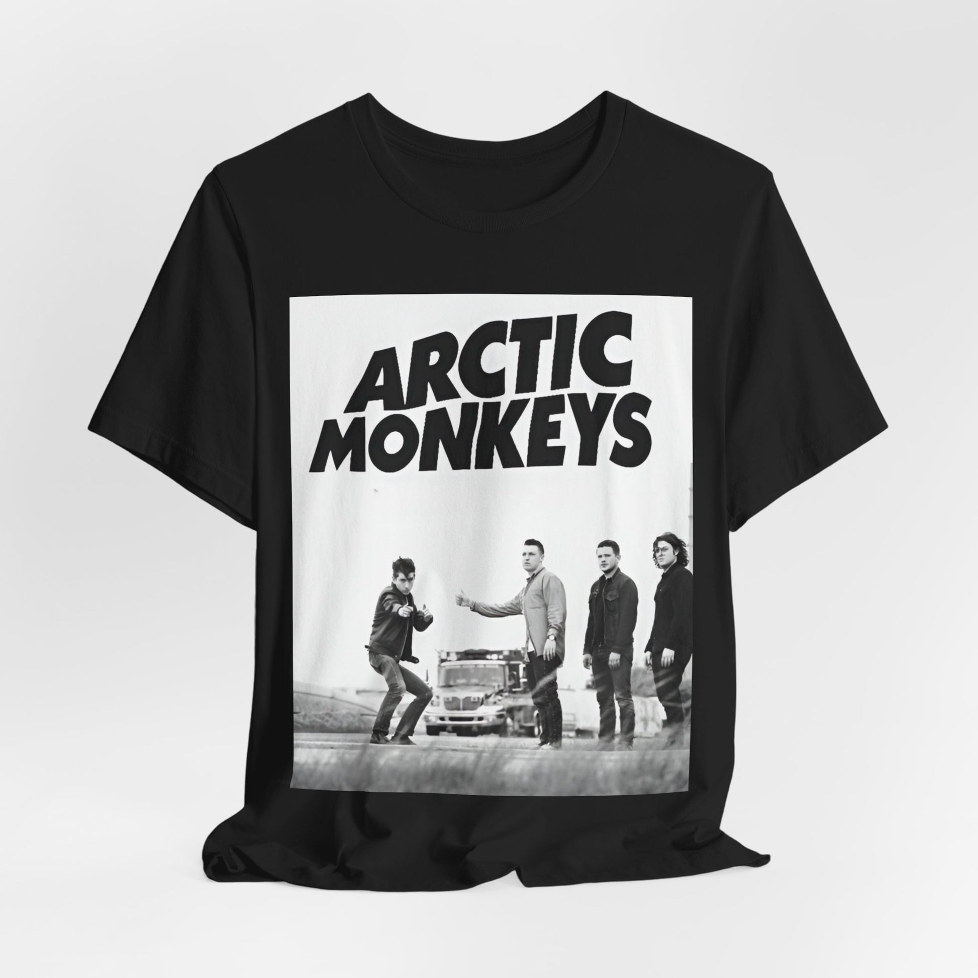 A black graphic t-shirt featuring the Arctic Monkeys logo in black and white.