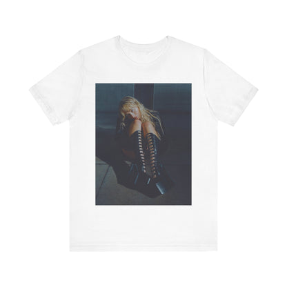 A black graphic t-shirt featuring a bold graphic of Sabrina Carpenter as a pop superstar.
