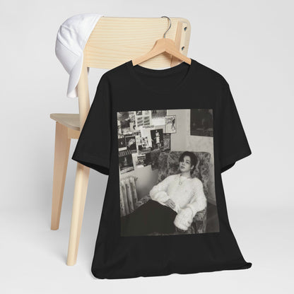 A black graphic t-shirt featuring a black and white portrait photo of Jimin.