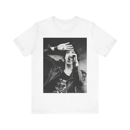 A black graphic t-shirt featuring a black and white portrait photo of The Strokes band.