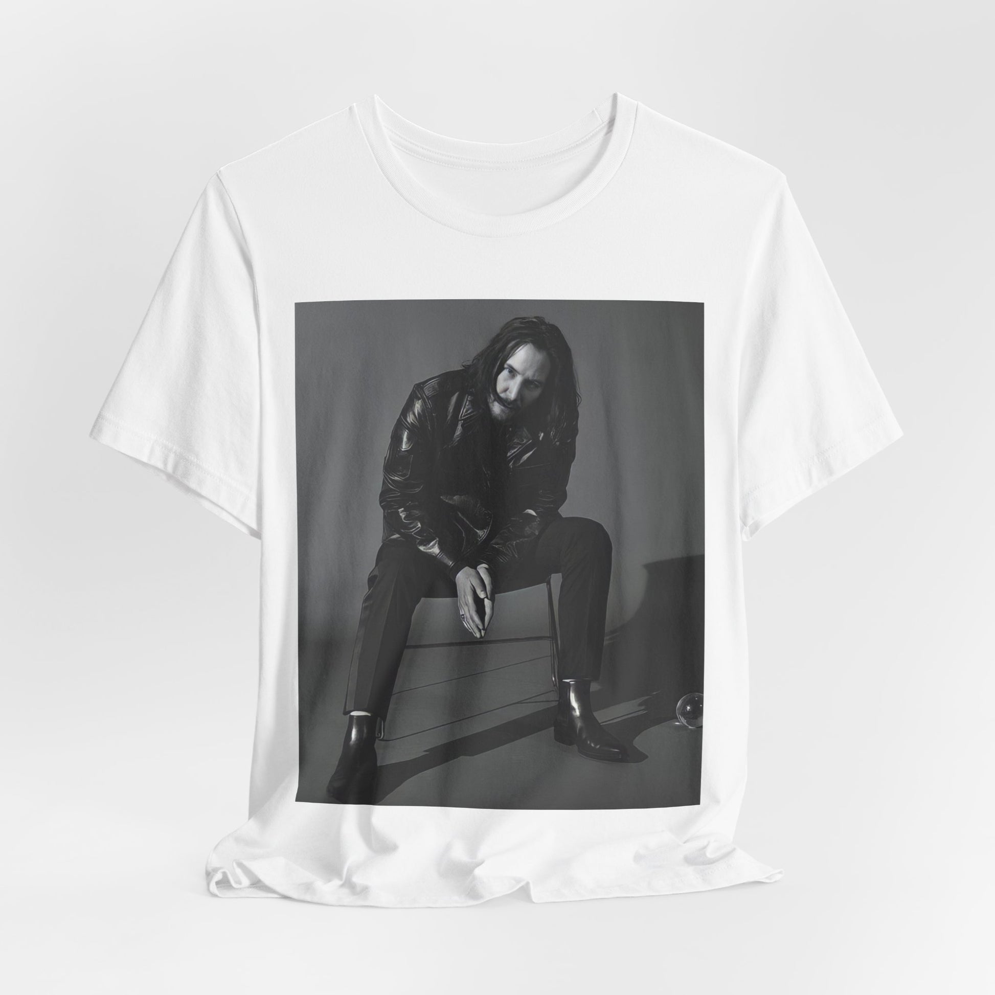 A black graphic t-shirt featuring a graphic of Keanu Reeves as John Wick.