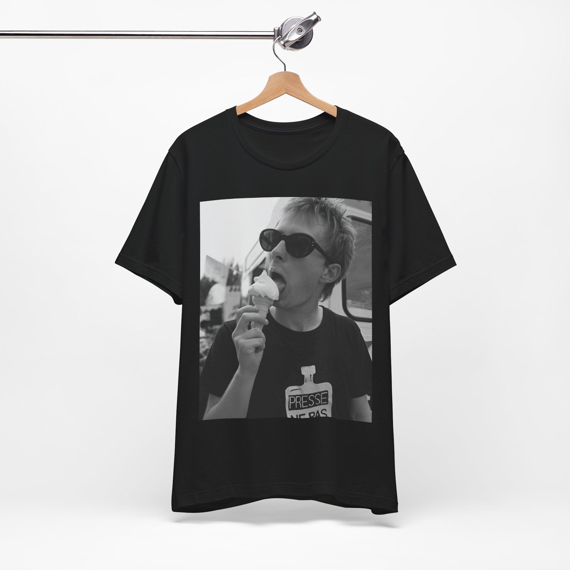 A black graphic t-shirt featuring a graphic of Thom Yorke from Radiohead with an ice cream cone.