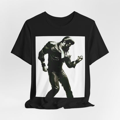 A black graphic t-shirt featuring a retro black and white monochrome photo or graphic of Elvis Presley.
