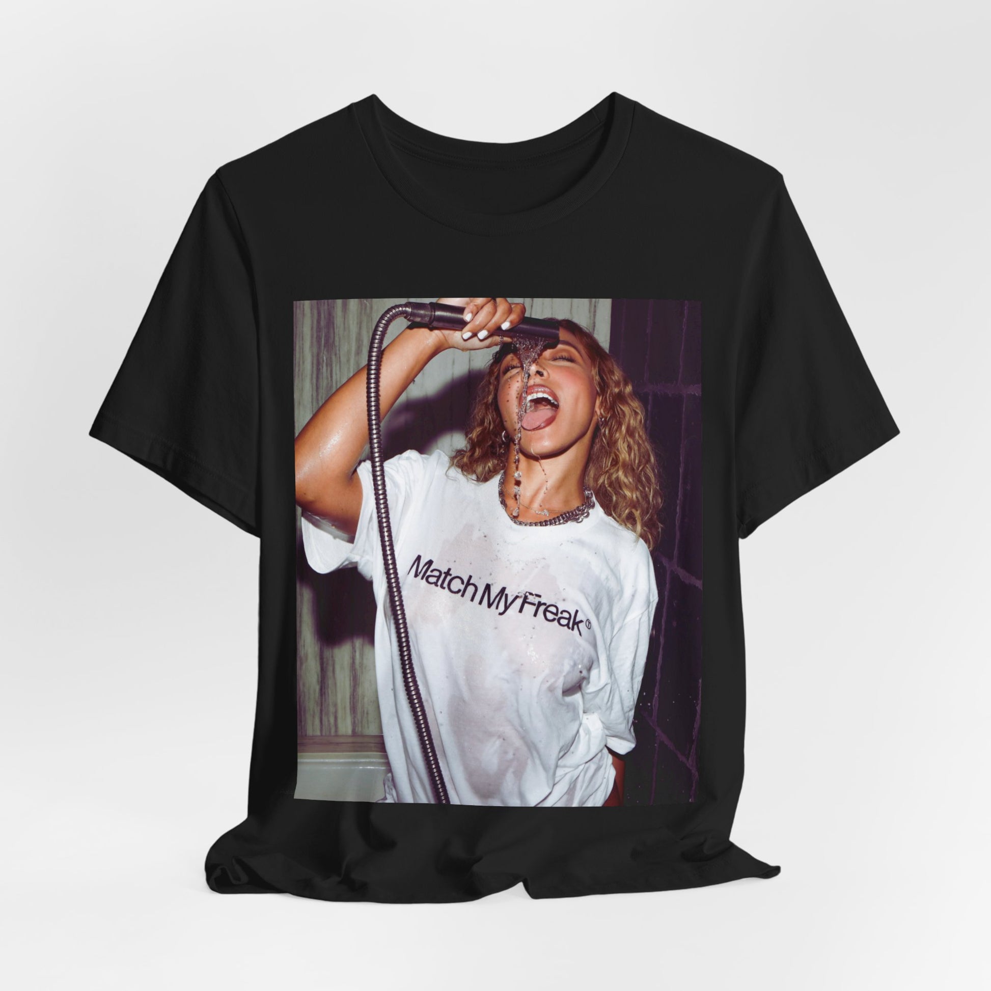 A black graphic t-shirt featuring an aesthetic graphic of Tinashe with a 'Nasty' vibe.
