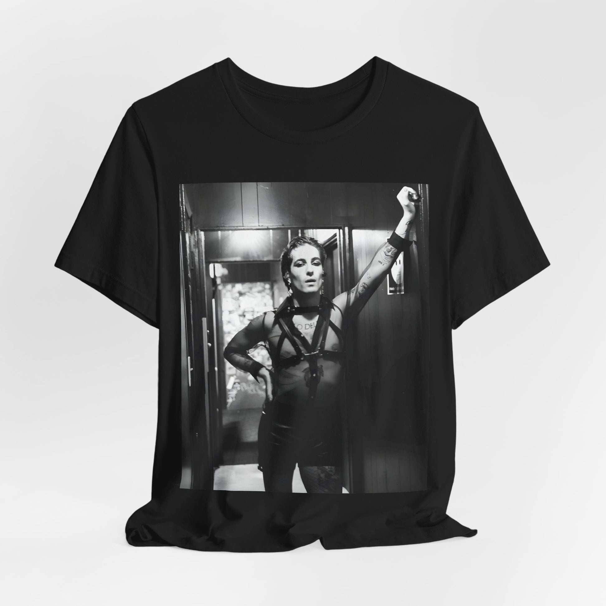 A black graphic t-shirt featuring a graphic of Maneskin emphasizing a rebel rock spirit.