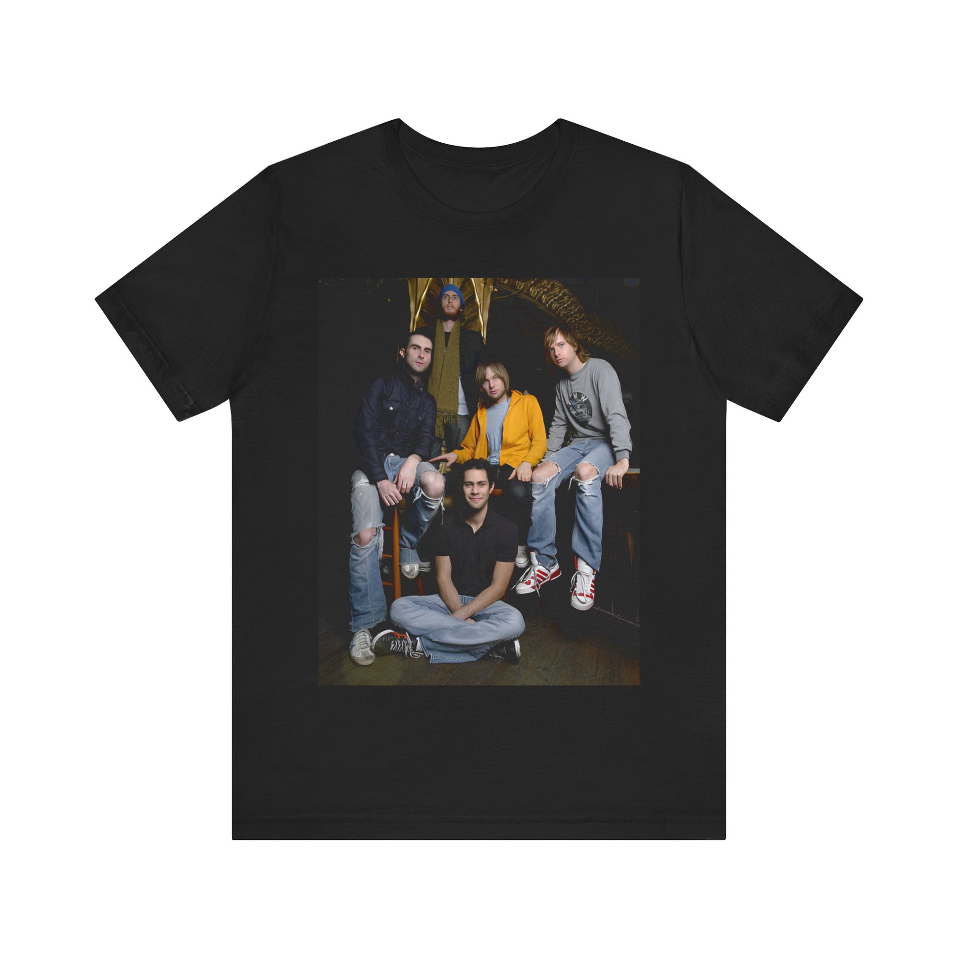 A high-energy, colorful photo of Maroon 5 performing live on stage at a concert, printed on a graphic t-shirt.