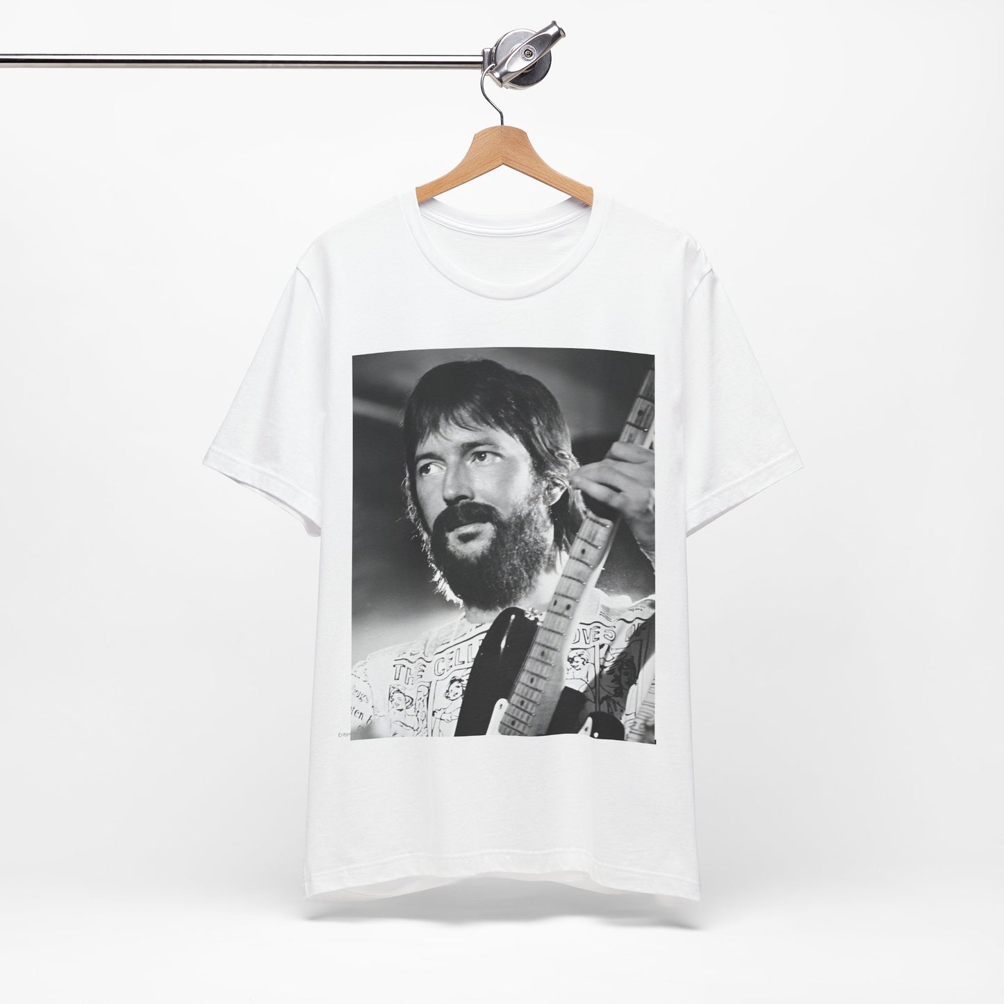 A black graphic t-shirt featuring a graphic of Eric Clapton as an authentic guitar god.