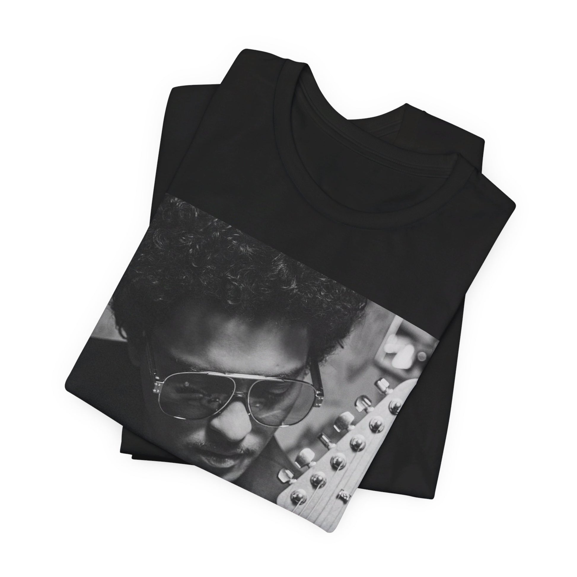 A black graphic t-shirt featuring a graphic of Bruno Mars in a classic crooner style.