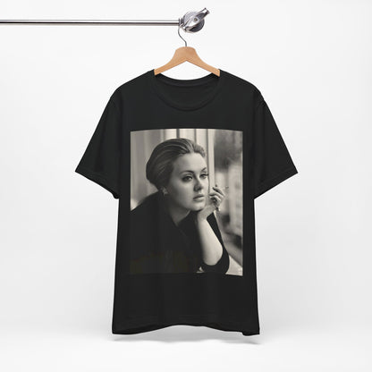A black graphic t-shirt featuring a black and white photo of Adele, showing her with a serene or thoughtful expression.