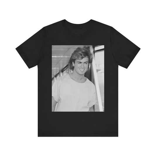 A black graphic t-shirt featuring an 80s black and white vintage photo or graphic of George Michael.