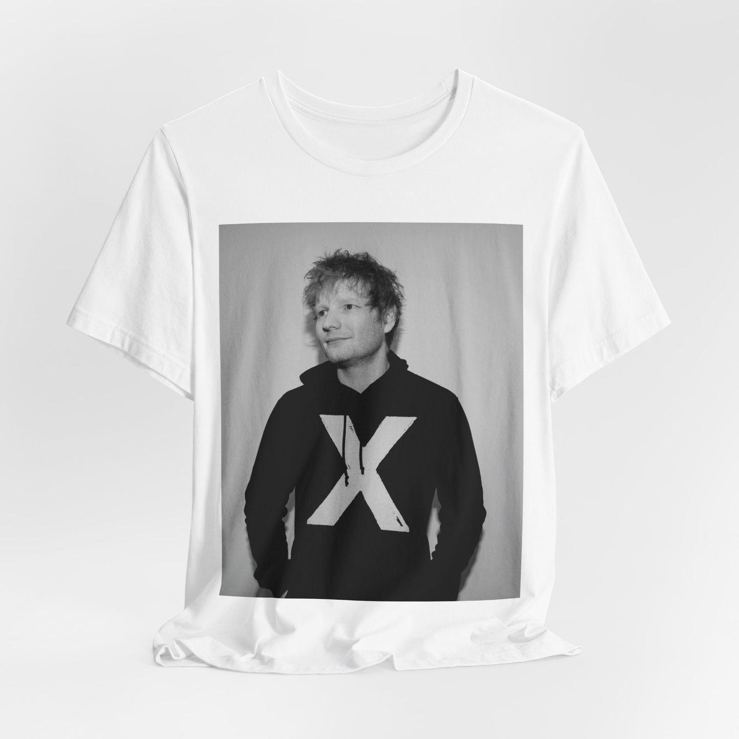 A black graphic t-shirt featuring a black and white graphic related to Ed Sheeran's album 'X'.