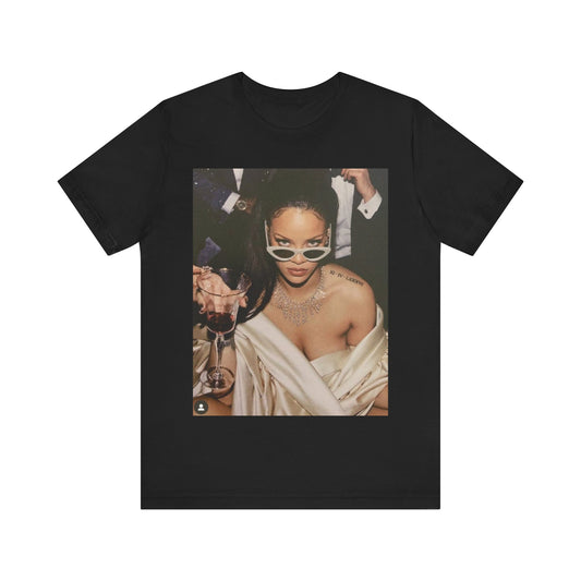 A black graphic t-shirt featuring a graphic of Rihanna as a 'Bad Gal Riri' fashion icon.