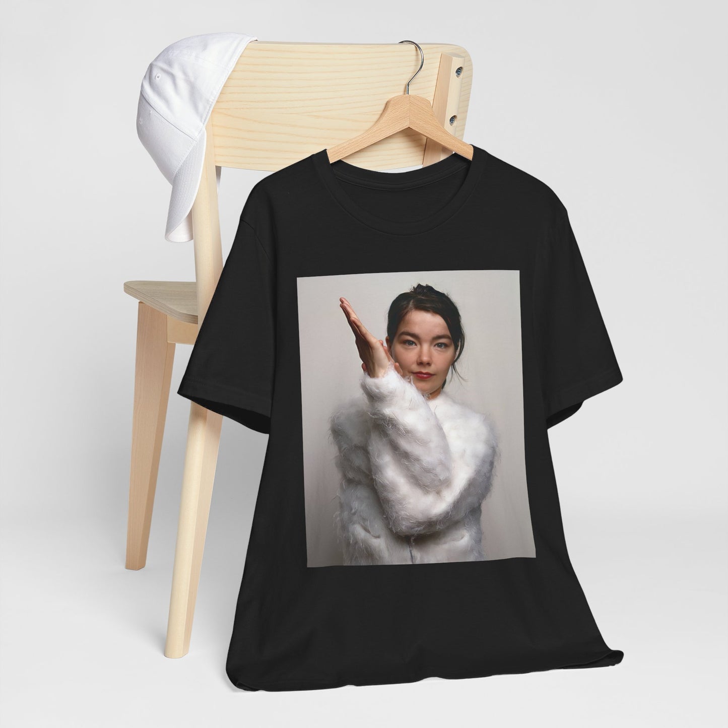 A black graphic t-shirt featuring a classic indie music graphic of Bjork.