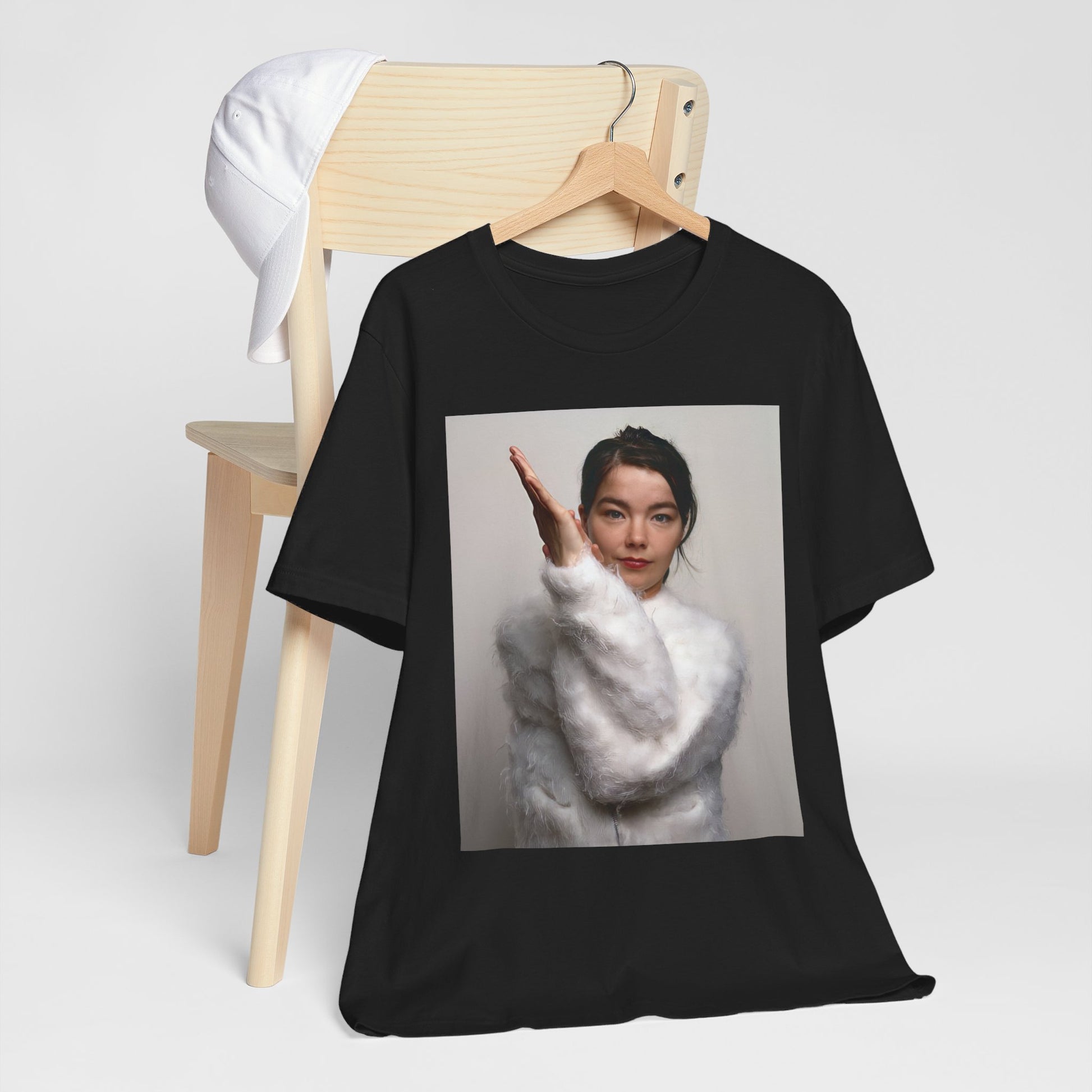 A black graphic t-shirt featuring a classic indie music graphic of Bjork.