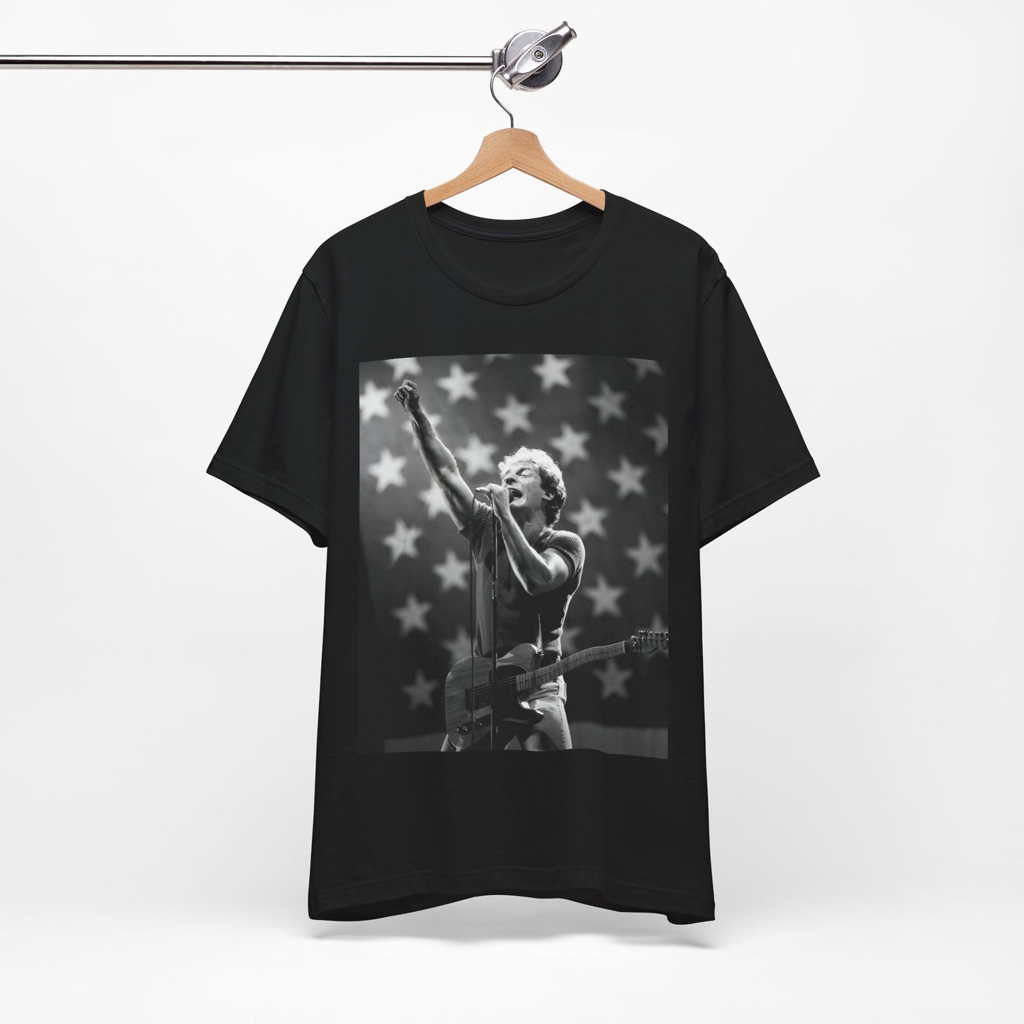 A black graphic t-shirt featuring a 70s era Americana-style graphic of Bruce Springsteen.
